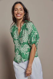 Model Amanda wearing size 10 of The Dolman Sleeve Button Up Shirt in colour Greenbloom (Green), from the front, cropped image