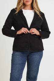 Model Chanel wearing size 16 of The Contrast Stitching Stretch Blazer in colour Black (Black), from the front, cropped image