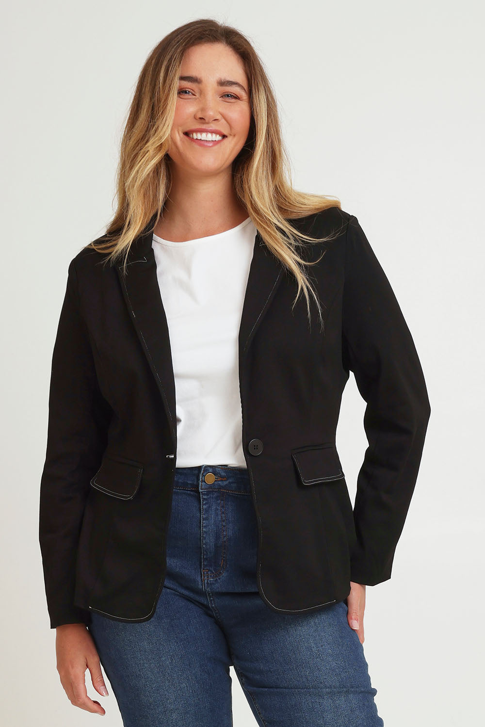 Model Chanel wearing size 16 of The Contrast Stitching Stretch Blazer in colour Black (Black), from the front, cropped image