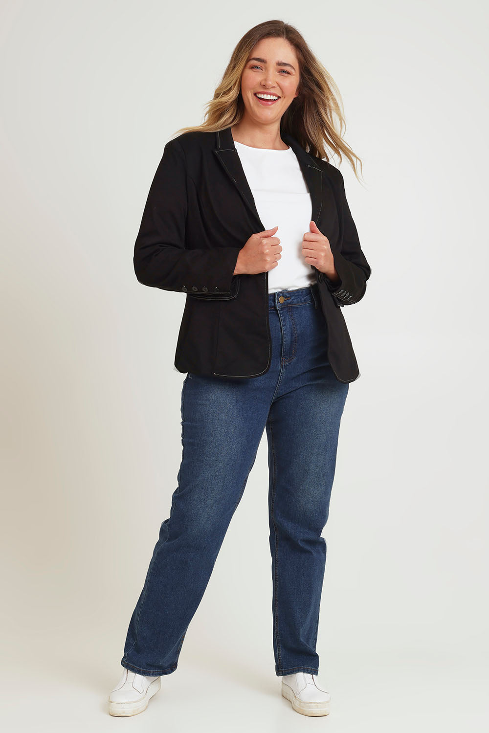 Model Chanel wearing size 16 of The Contrast Stitching Stretch Blazer in colour Black (Black), from the front, showing the whole outfit