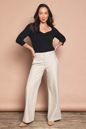 Model Katie wearing size S of The Rib Knit Sweetheart Neck Top in colour Black (Black), from the front, showing the whole outfit