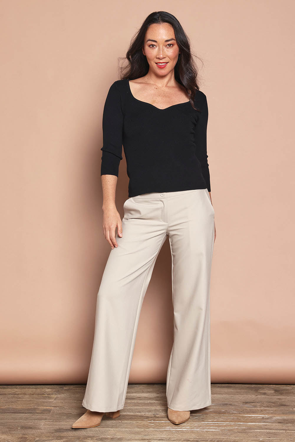 Model Katie wearing size S of The Rib Knit Sweetheart Neck Top in colour Black (Black), from the front, showing the whole outfit