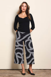 Model Madelinec wearing size 10 of the The Rib Knit Sweetheart Neck Top – Black in colour Black, from the front