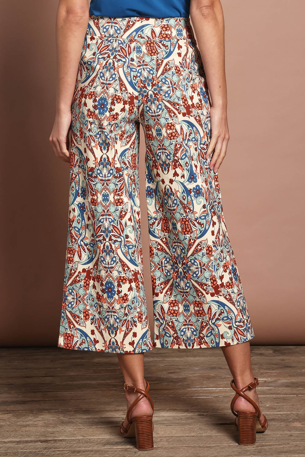 Model Madeline wearing size 10 of The Printed Wide Leg Culotte in colour Mirage, from the back