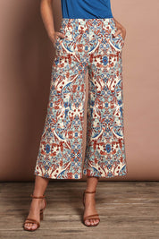 Model Madeline wearing size 10 of The Printed Wide Leg Culotte in colour Mirage, from the front, cropped image