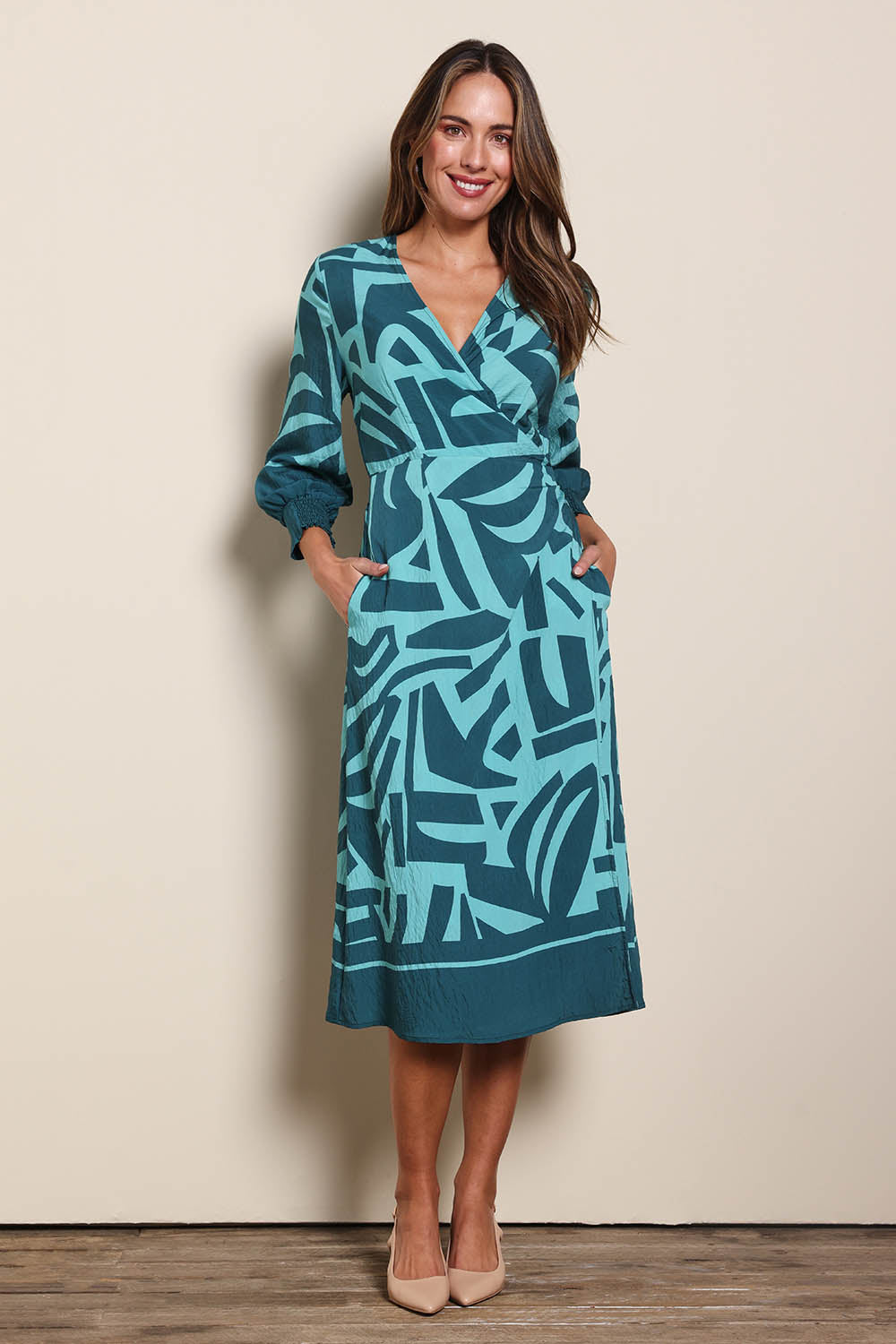 Model Madelinec wearing size 10 of the The Printed Wrap Dress - Abstract in colour Abstract, from the front