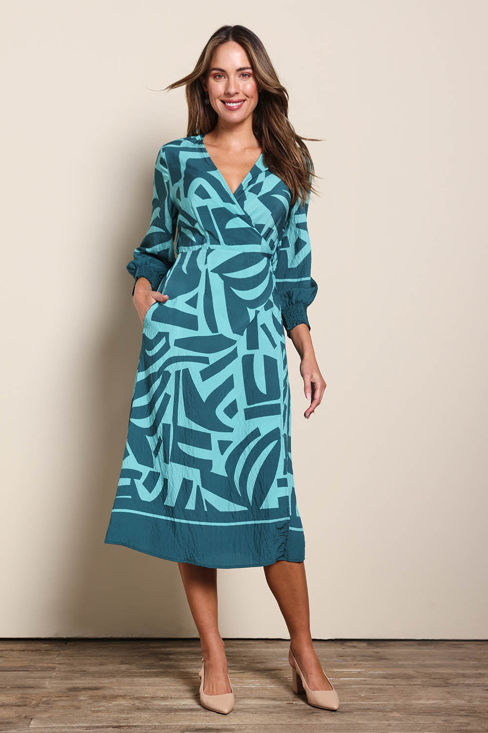 Model Madelinec wearing size 10 of the The Printed Wrap Dress - Abstract in colour Abstract, from the front