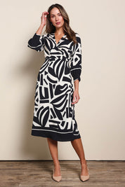 Model Madelinec wearing size 10 of the The Printed Wrap Dress - Blackabstract in colour Blackabstract, from the front