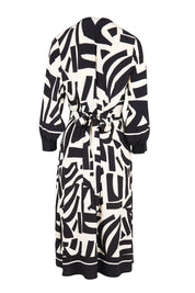 Product shot of the The Printed Wrap Dress - Blackabstract in colour Blackabstract, from the back