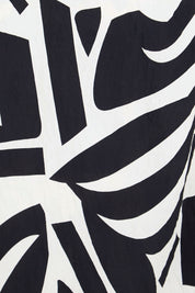 Product shot of the The Printed Wrap Dress - Blackabstract in colour Blackabstract, showing detail
