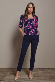 Model Madeline wearing size 10 of The Printed Square Neck Blouse in colour Nightpetal (Blue), from the front, showing the whole outfit