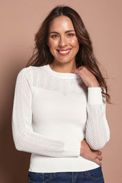Model Madeline wearing size S of The Pointelle Detail Knit Top in colour Snow (White), from the front, cropped image