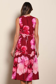 Model Madelinec wearing size 10 of the The Printed Sleeveless Wrap Dress - Pinkhibiscus in colour Pinkhibiscus, from the back