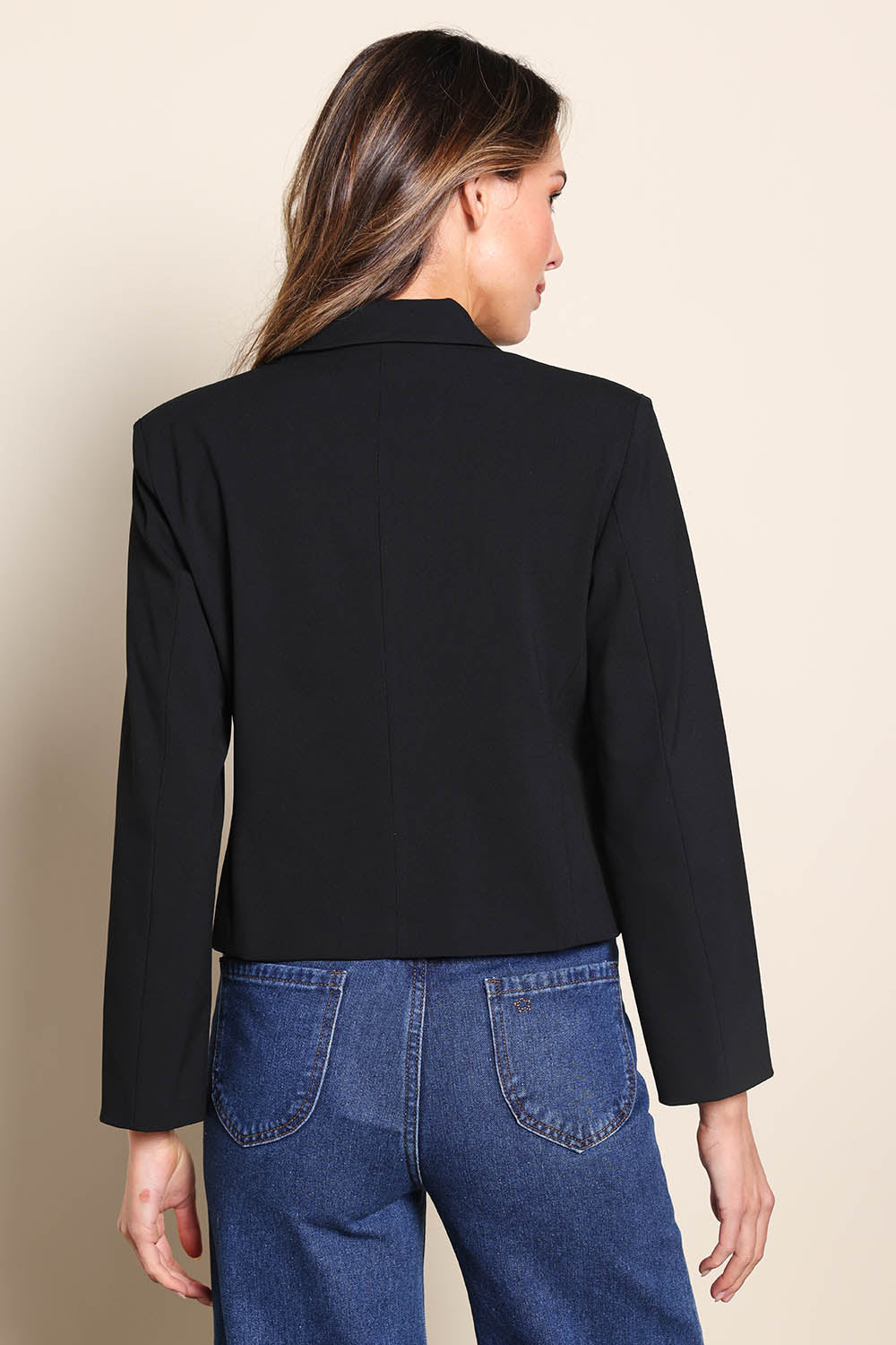 Model Madelinec wearing size 10 of the The Buttoned Blazer With Pocket Details – Black in colour Black, from the back