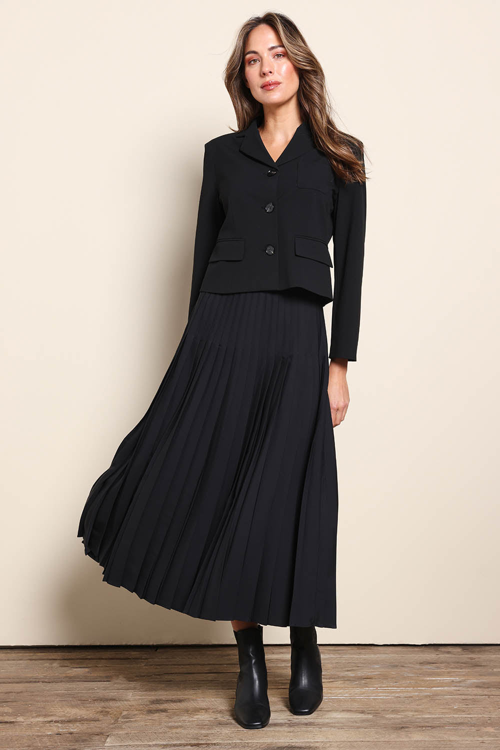 Model Madelinec wearing size 10 of the The Buttoned Blazer With Pocket Details – Black in colour Black, from the front