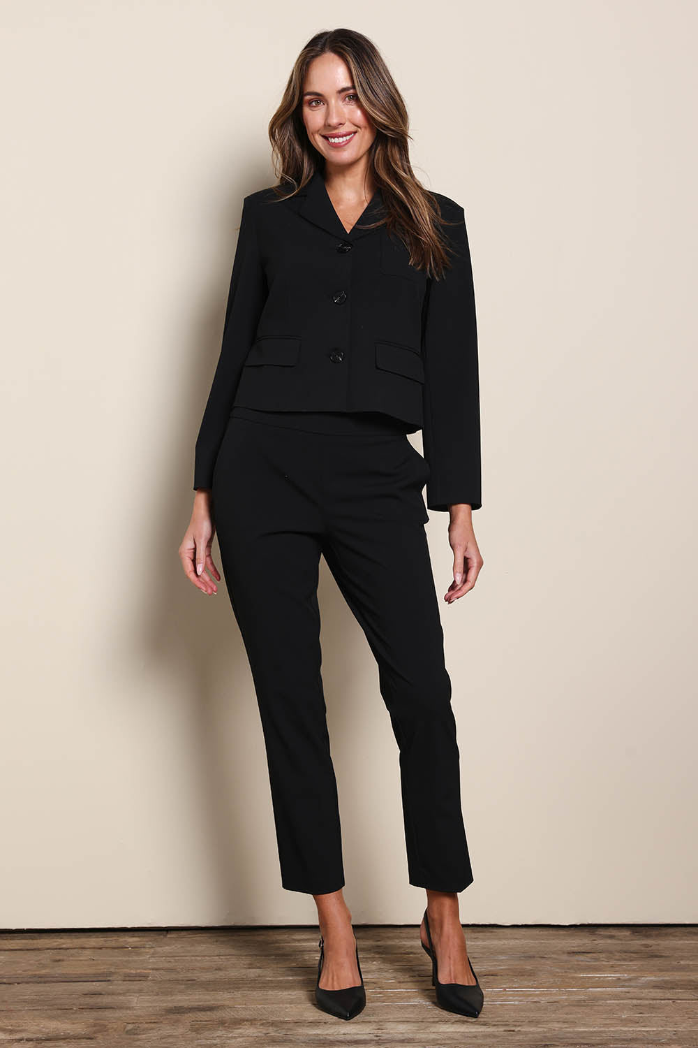 Model Madelinec wearing size 10 of the The Buttoned Blazer With Pocket Details – Black in colour Black, from the front
