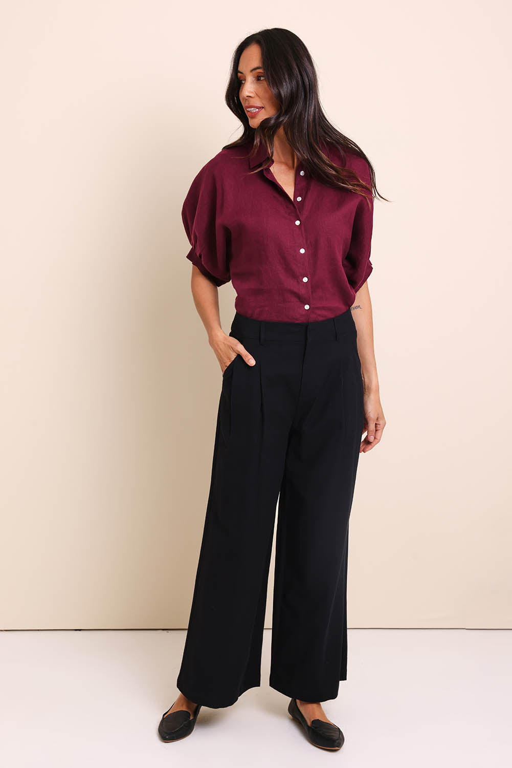 Model Amandam wearing size 10 of the The Linen Blend Tailored Pant - Black in colour Black, from the front