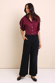 Model Amandam wearing size 10 of the The Linen Blend Tailored Pant - Black in colour Black, from the front