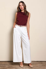 Model Madelinec wearing size 10 of the The Linen Blend Tailored Pant - Snow in colour Snow, from the front