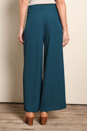 Model Madelinec wearing size 10 of the The Soft Suiting Pant – Darkteal in colour Darkteal, from the back