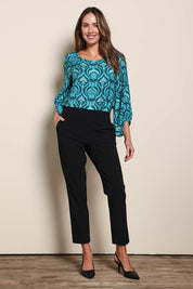 Model Maddiec wearing size 10 of the The Tapered Pull On Stretch Pant – Black in colour Black, from the front