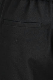 Product shot of the The Tapered Pull On Stretch Pant – Black in colour Black, showing detail