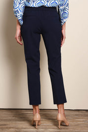 Model Madelinec wearing size 10 of the The Tapered Pull On Stretch Pant – Navy in colour Navy, from the back
