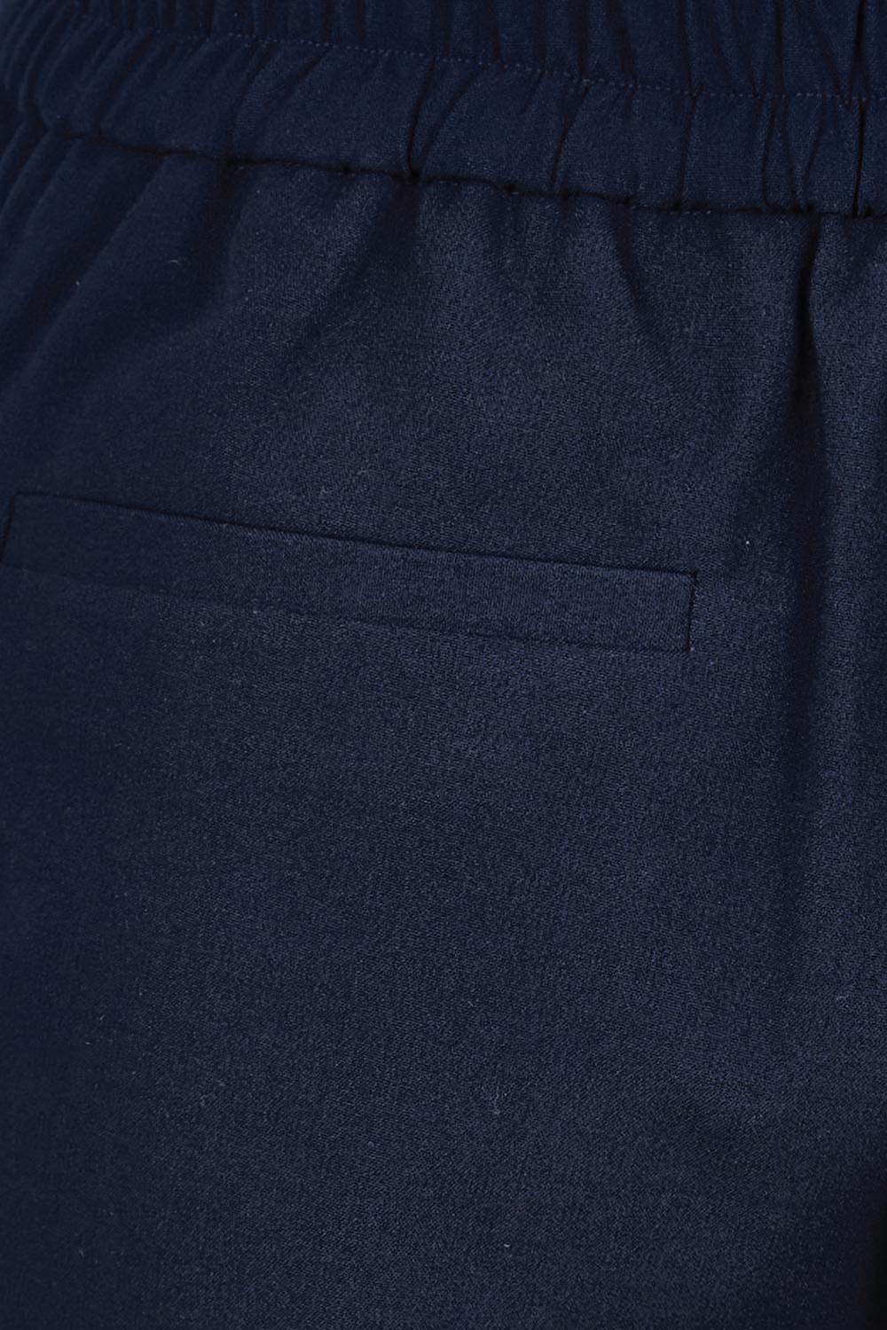 Product shot of the The Tapered Pull On Stretch Pant – Navy in colour Navy, showing detail