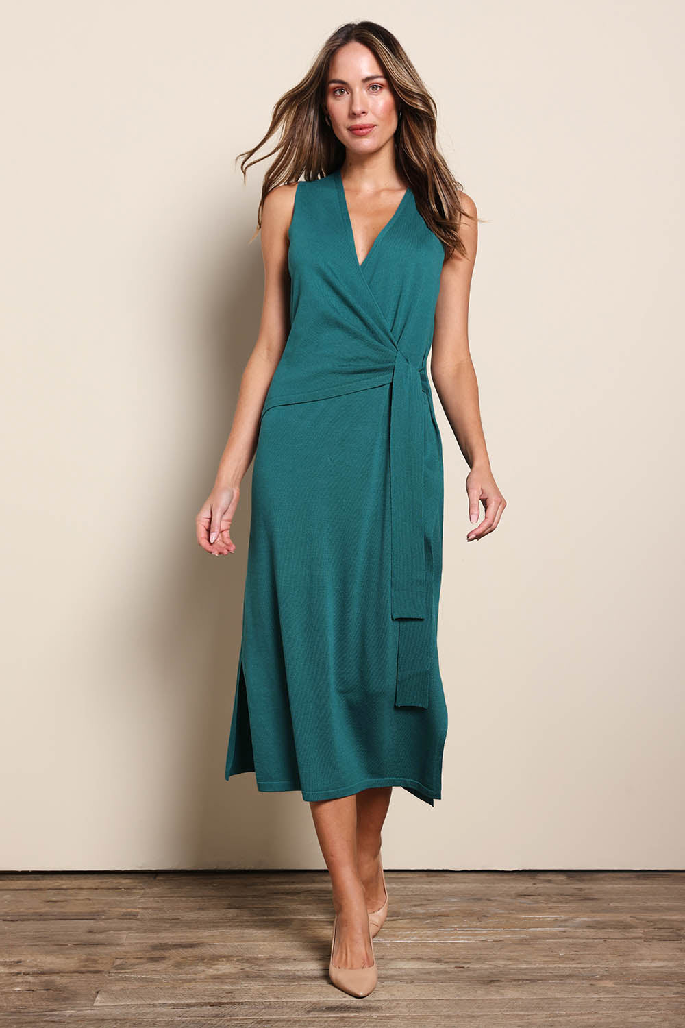 Model Madelinec wearing size 10 of the The All Season Faux Wrap Knit Dress – Jewel in colour Jewel, from the front