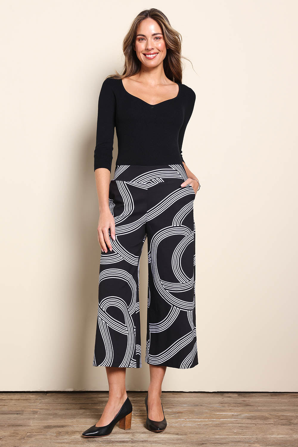 Model Madelinec wearing size 10 of the The Printed Stretch Wide Leg Culotte – Contour in colour Contour, from the front