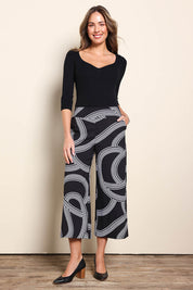 Model Madelinec wearing size 10 of the The Printed Stretch Wide Leg Culotte – Contour in colour Contour, from the front