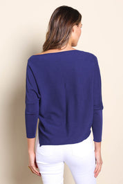 Model Madelinec wearing size 10 of the The Pleated Shoulder Knit – Indigoblue in colour Indigoblue, from the back