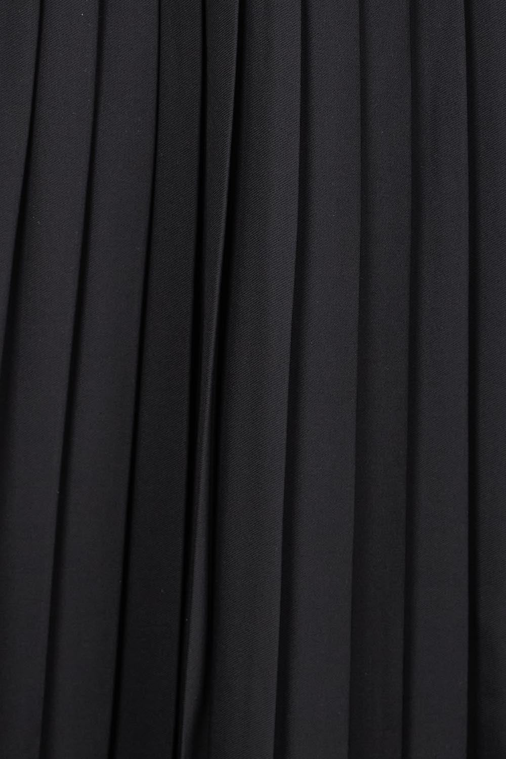 Product shot of the The Luxe Pleated Skirt – Black in colour Black, showing detail