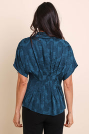 Model Amandam wearing size 10 of the The Jacquard Pleated Shirt - Darkpeacock in colour Darkpeacock, from the back