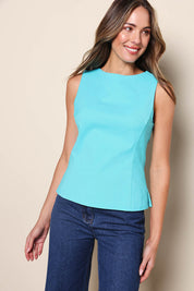 Model Madelinec wearing size 10 of the The Stretch Boat Neck Top – Aquablue in colour Aquablue, in a cropped view