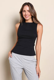 Model Madelinec wearing size 10 of the The Stretch Boat Neck Top – Black in colour Black, in a cropped view