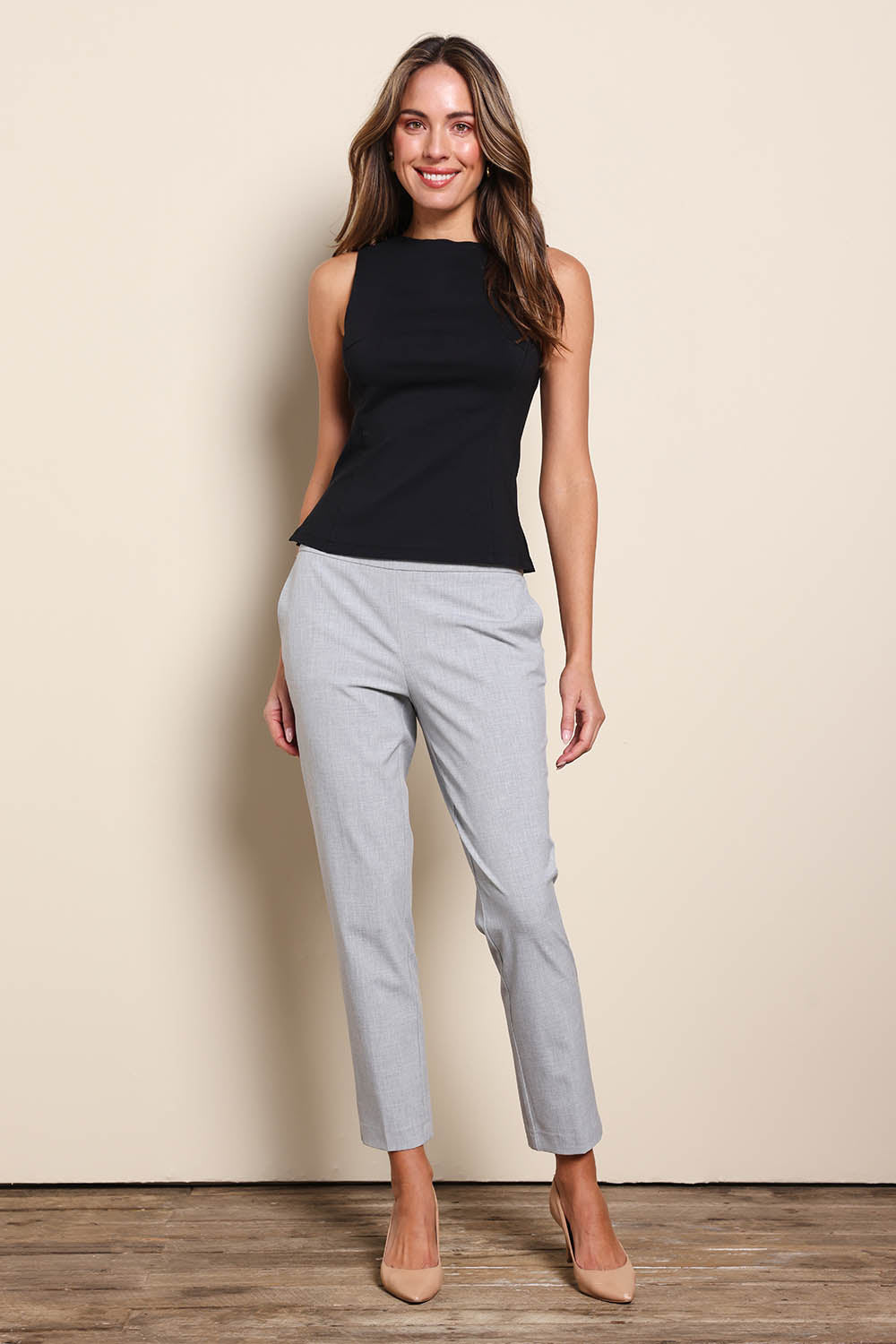 Model Madelinec wearing size 10 of the The Stretch Boat Neck Top – Black in colour Black, from the front