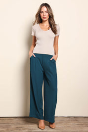 Model Madelinec wearing size 10 of the The Reversible Rib Knit Top – Biscotti in colour Biscotti, from the front