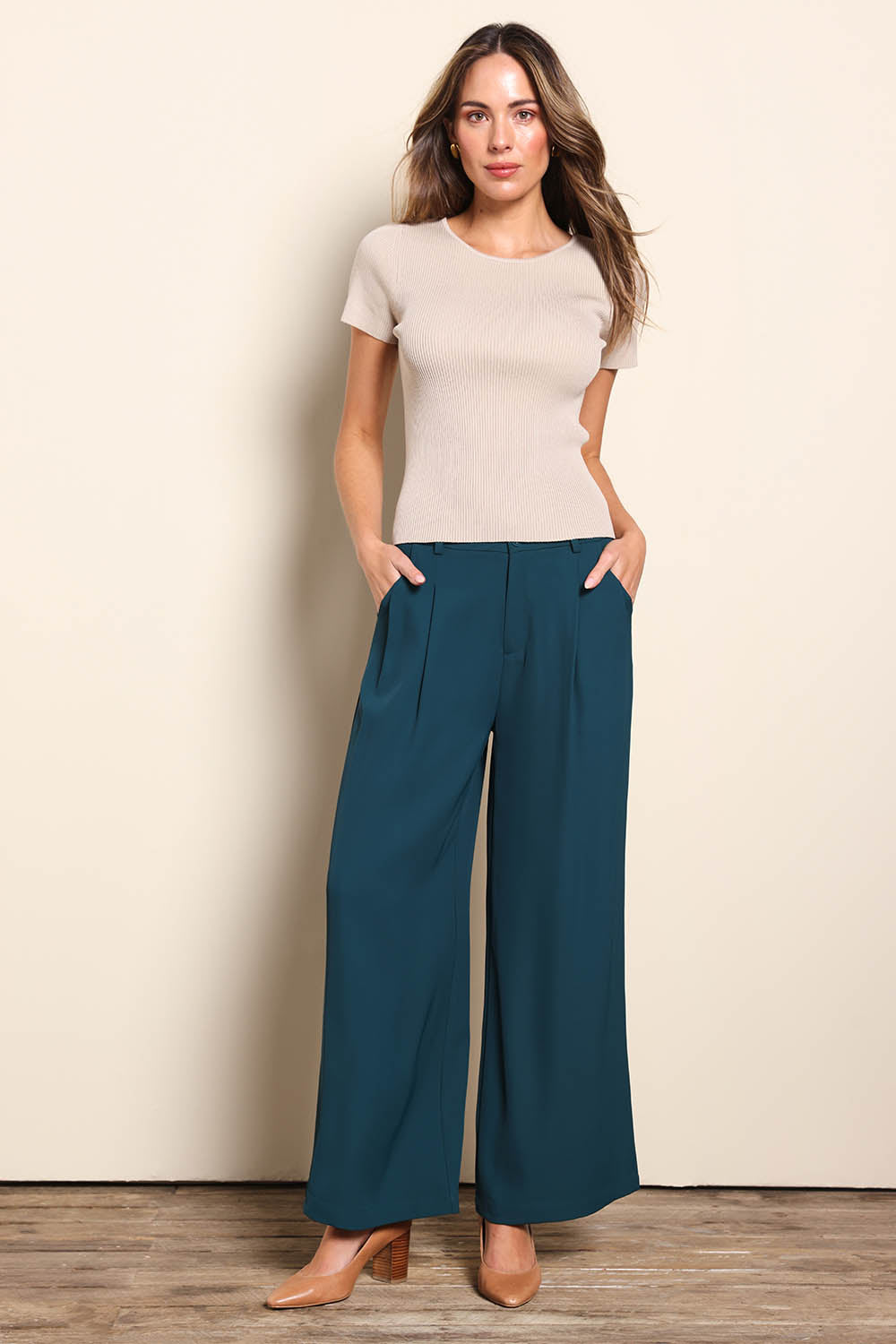 Model Madelinec wearing size 10 of the The Reversible Rib Knit Top – Biscotti in colour Biscotti, from the front