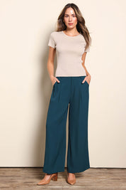 Model Madelinec wearing size 10 of the The Reversible Rib Knit Top – Biscotti in colour Biscotti, from the front