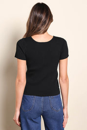 Model Madelinec wearing size 10 of the The Reversible Rib Knit Top – Black in colour Black, from the back