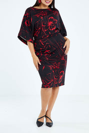 Model Sasha-Lee wearing size 16 of The Printed Kimono Sleeve Pencil Dress in colour Redfleur (Black), from the front, cropped image