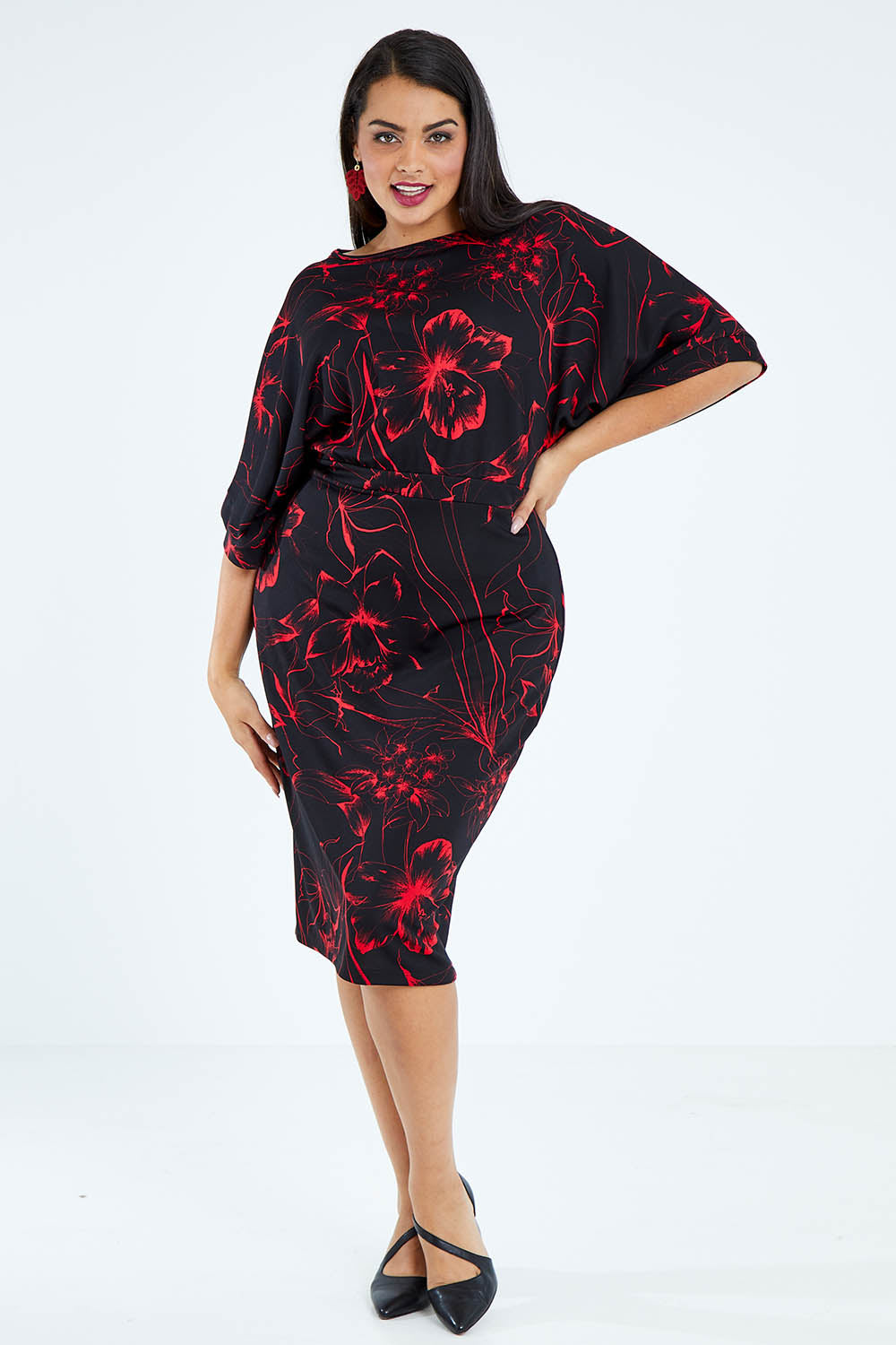 Model Sasha-Lee wearing size 16 of The Printed Kimono Sleeve Pencil Dress in colour Redfleur (Black), from the front, showing the whole outfit