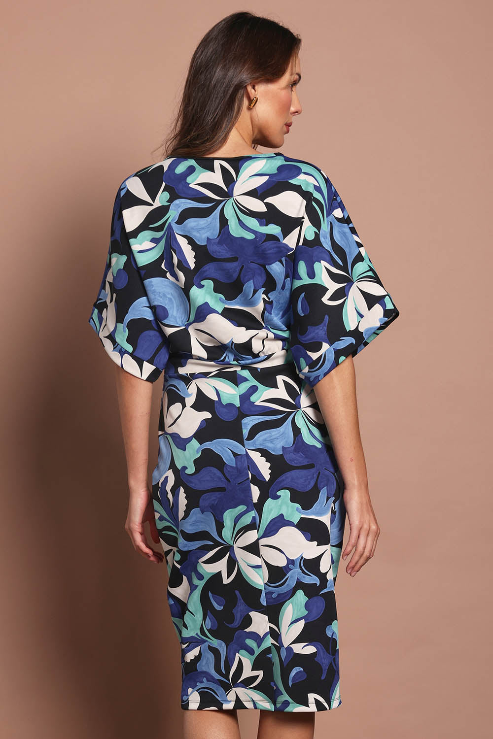 Model Madeline wearing size 10 of The Printed Kimono Sleeve Pencil Dress in colour Oceanbloom (Blue), from the back