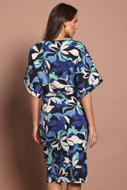 Model Madeline wearing size 10 of The Printed Kimono Sleeve Pencil Dress in colour Oceanbloom (Blue), from the back