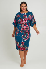 Model Ashleigh wearing size 16 of The Printed Kimono Sleeve Pencil Dress in colour Tealtropic (Blue), from the front, showing the whole outfit