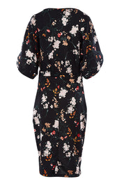 Product shot of The Printed Kimono Sleeve Pencil Dress in colour Garden (Black), from the back