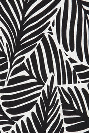Product shot of The Printed Reversible Cowl Neck Top in colour Leaf (Black), detail