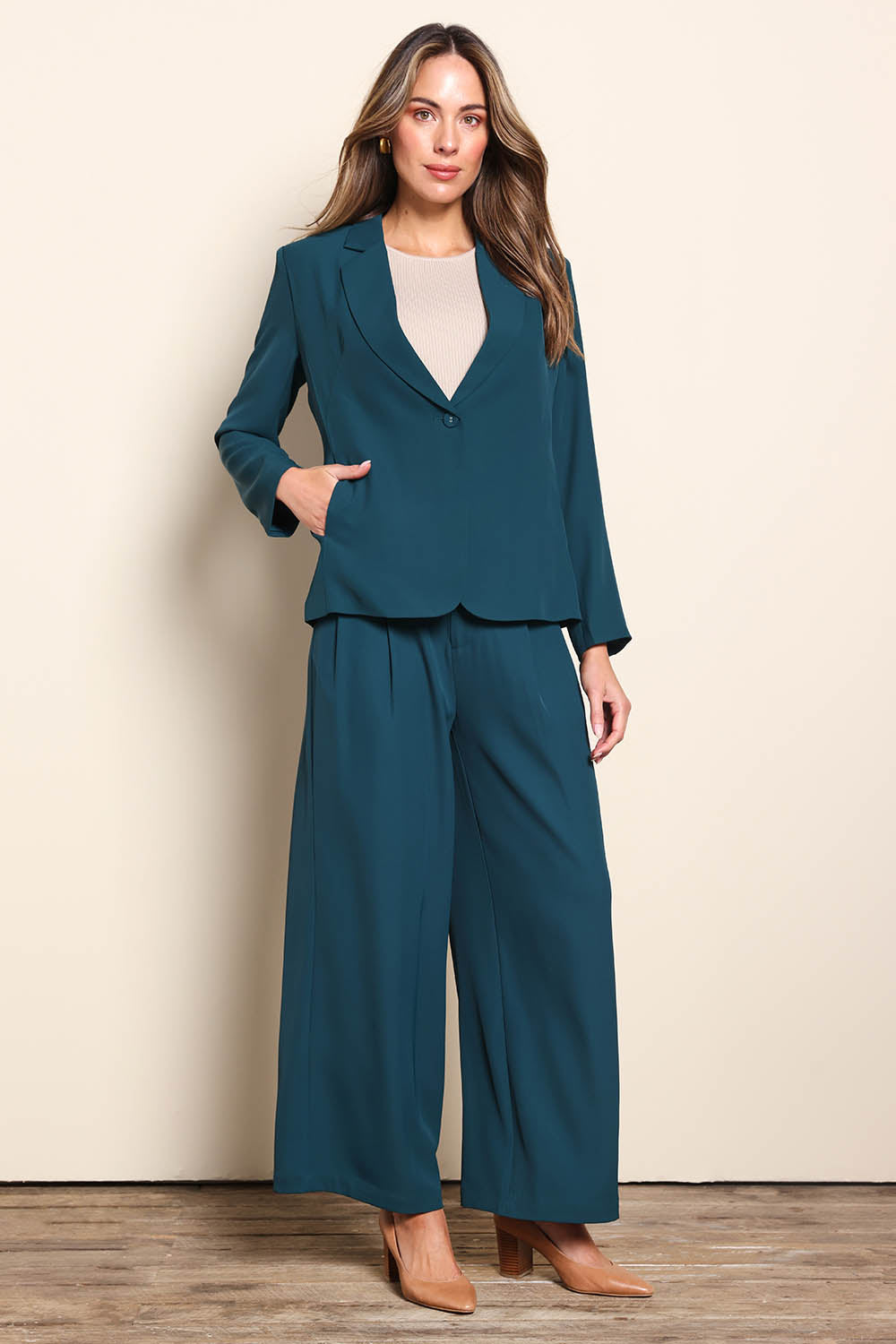 Model Madelinec wearing size 10 of the The Soft Suiting Lined Button Blazer – Darkteal in colour Darkteal, from the front