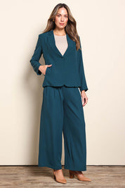 Model Madelinec wearing size 10 of the The Soft Suiting Lined Button Blazer – Darkteal in colour Darkteal, from the front
